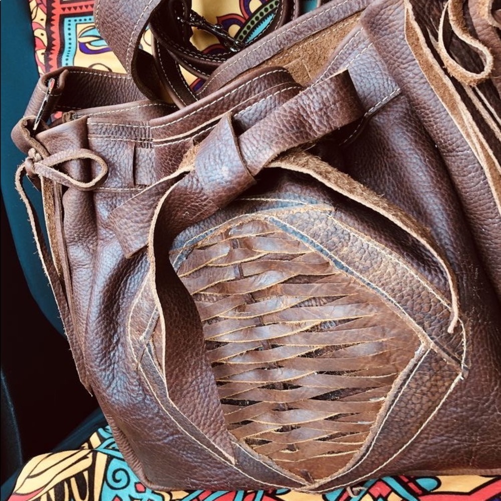 Custome real leather purse. long shoulder strap deep inside. No extra pockets.